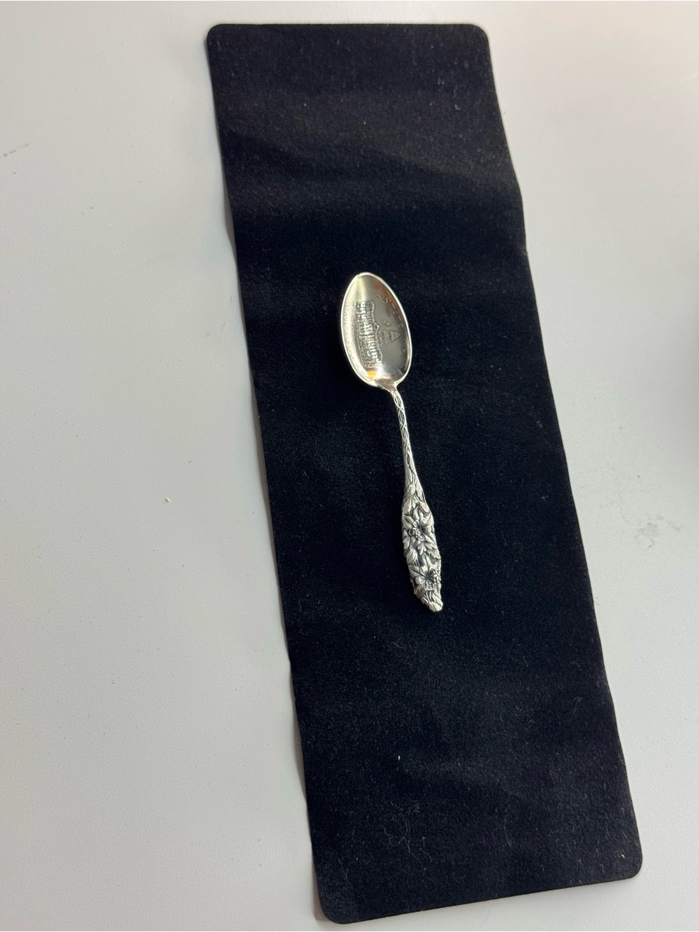 Ornate Silver-Colored Collectible Silver Spoon